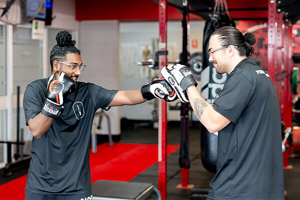 Exercise physiologist and personal trainer using boxing for training